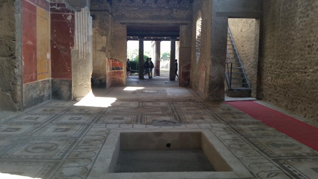 I.7.1 Pompeii. August 2016.
Looking south across impluvium in atrium, towards tablinum, oecus and peristyle. Photo courtesy of Maribel Velasco.