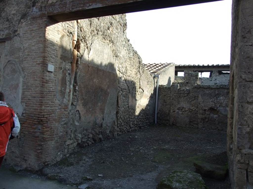 I.7.4 Pompeii. December 2007. Entrance, looking south.
According to Wallace-Hadrill, this was a taberna/officina vasaria of Corinthus, servus of P. Cornelius?.
This comprised of two rooms and stairs up to an upper floor, but no decoration was found.
Finds of pottery have suggested “officina vasaria” (a potter’s shop).
See Wallace-Hadrill, A., 1994. Houses and Society in Pompeii and Herculaneum. New Jersey: Princeton U.P. (p.189).
According to Spinazzola,
A "Corinthus" appears here, with pottery skills in terracotta, which may perhaps be attributed to a single "Figulus" (latin: potter/worker of earthenware) of exception: a large thick table/board with raised border (m. 1.18 side to side), was found mutilated in a house not yet explored on the side of Via di Abbondanza (II.2.4 or I.12.4), and a large vase with ornate decoration in relief, which more precisely identified him as a true artist, (from i.7.2/3).
In the great table he signed his skilful piece of pottery, accompanying his name with the pottery workshop "de fi(glinis) C(ai) Cluenti Ampliati – Corinthus fecit", of which he evidently was the master operator, and, in the vase, with the entire description, which more precisely identified him:
"P. Corneli Corint(h)i servos"
See Spinazzola, V. Pompei, alla luce degli Scavi Nuovi di Via dell’Abbondanza (Anni 1910-1923), Vol.2, (p.687, fig.651).
See Maiuri, A., 1928. Nuovi Scavi nella Via dell’Abbondanza. Milano: Hoepli. (p.15-16).
See Notizie degli Scavi di Antichità, 1912, p. 65-7.
See Notizie degli Scavi di Antichità, 1927, (p. 12).