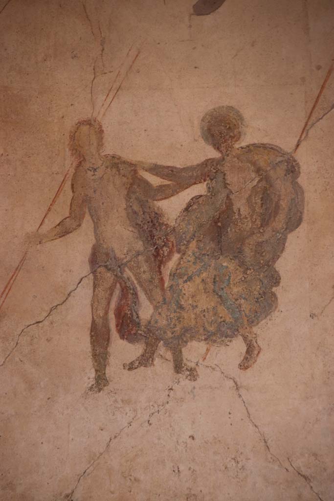 I.7.11 Pompeii. September 2021.
Detail of painted decoration from centre of panel at west end of north wall. Photo courtesy of Klaus Heese.
