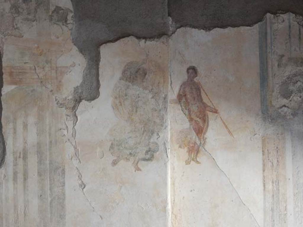 I.7.11 Pompeii. May 2017. Detail of painted figures on east end of north wall of triclinium. Photo courtesy of Buzz Ferebee.