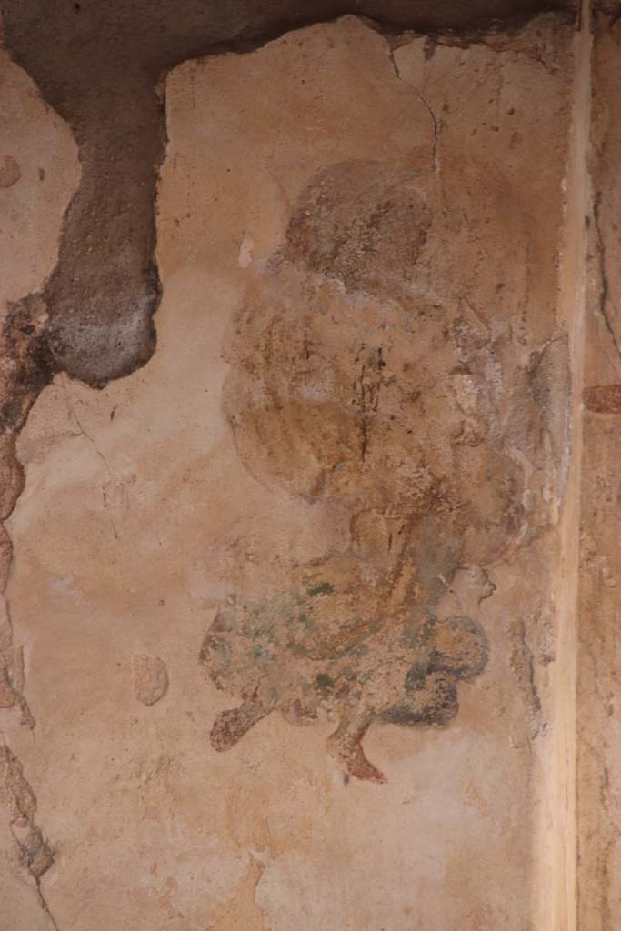 I.7.11 Pompeii. September 2021.
Detail of figure from panel at east end of north wall of triclinium. Photo courtesy of Klaus Heese.