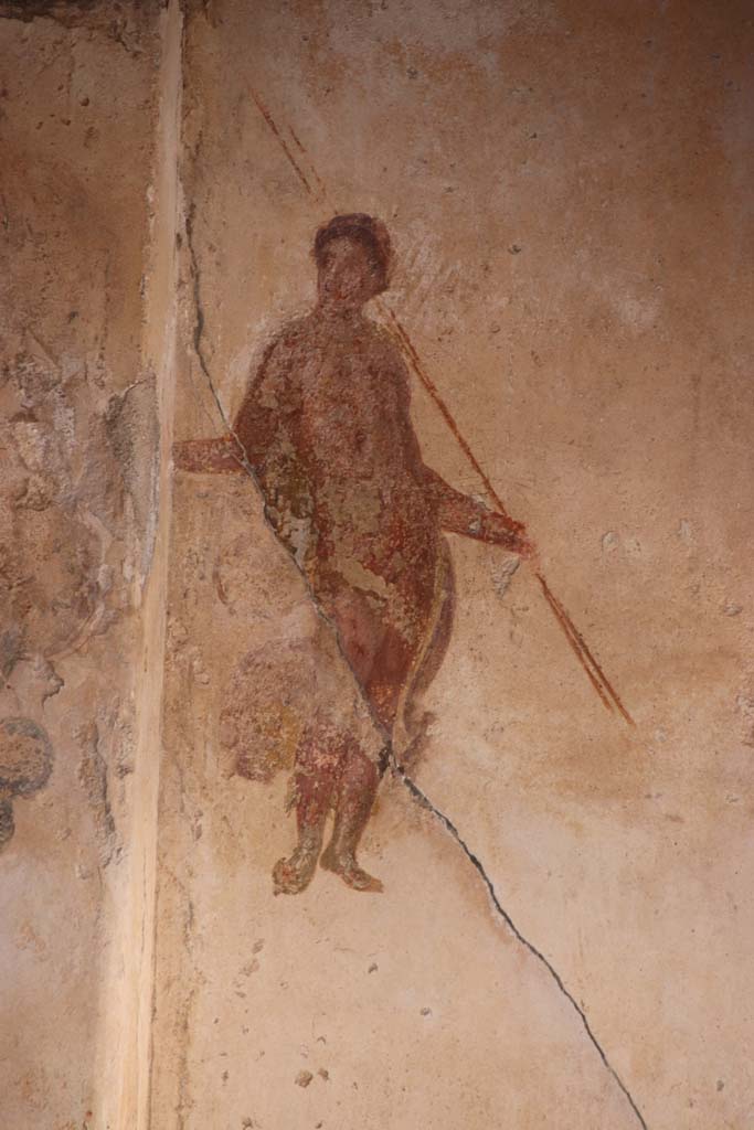 I.7.11 Pompeii. September 2021.
Detail of second figure from panel at east end of north wall of triclinium. Photo courtesy of Klaus Heese.