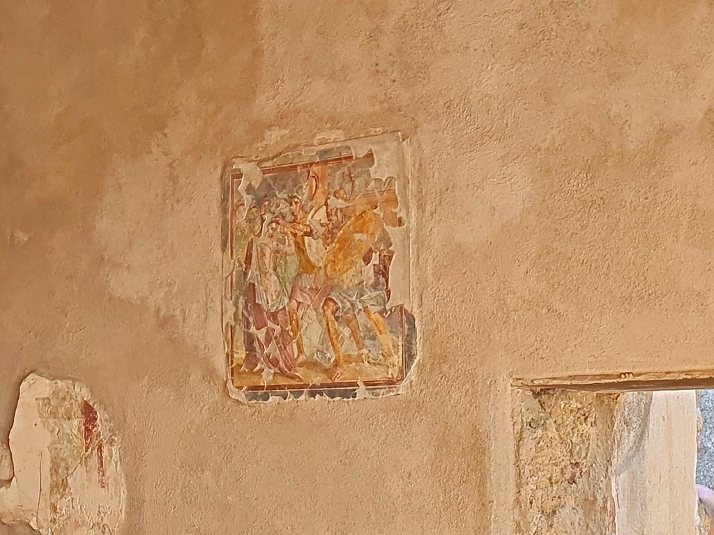 I.7.11 Pompeii. March 2024.
Central wall painting from east wall of triclinium (but originally on west wall), of the painting of Helen and Menelaus.
Photo courtesy of Giuseppe Ciaramella.