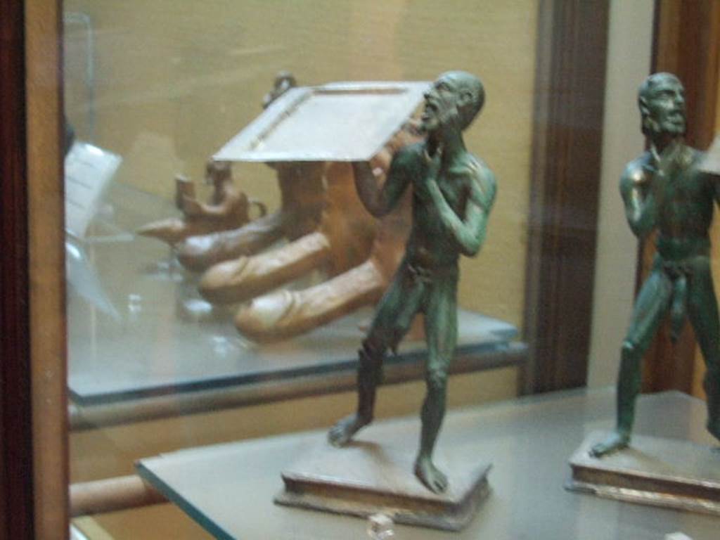 Bronze statues found in I.7.10-12. Now in Naples Archaeological Museum. Inventory number 143760.