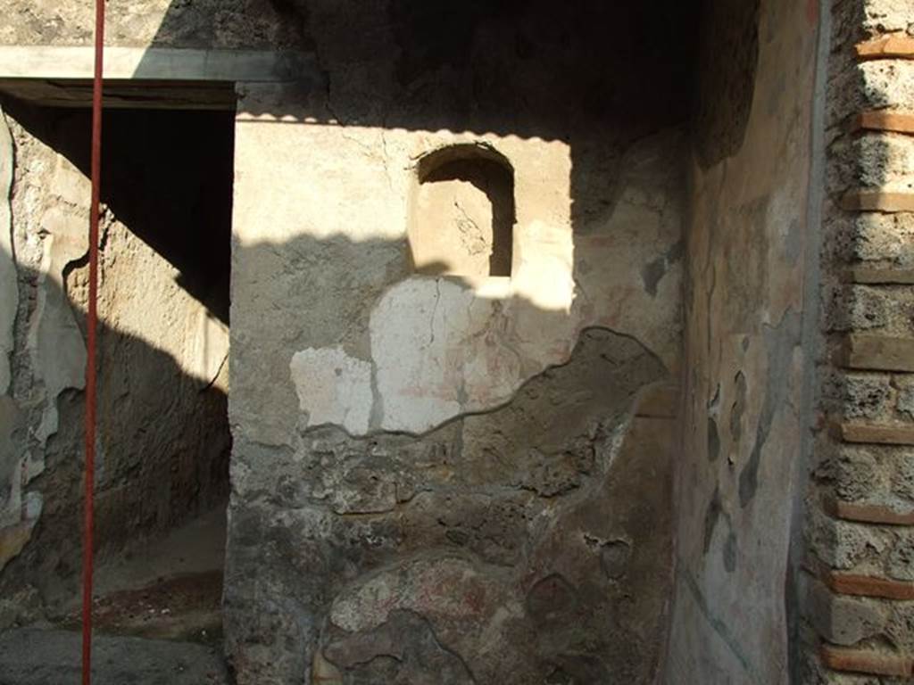 I.7.11 Casa dell’ Efebo or Domus P. Cornelius Tages. Remains of Lararium on east side of atrium belonging to original house I.7.10. See Fröhlich, T., 1991, Lararien und Fassadenbilder in den Vesuvstädten. Mainz: von Zabern. (L5:p.251, T: 3,1, 24,1)