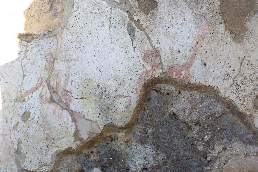 I.7.11 Pompeii. December 2018. Remains of Lararium on east side of atrium belonging to original house I.7.10.
The remaining Lar can be seen on the right of the Genius. Photo courtesy of Aude Durand.