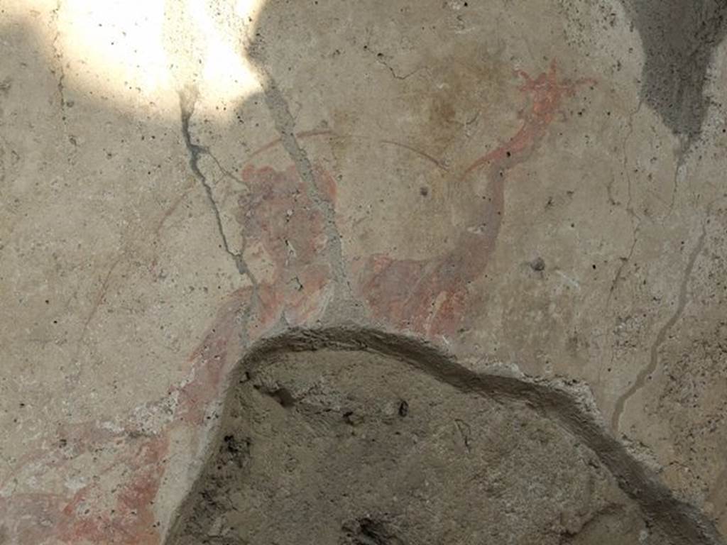 I.7.11 Pompeii. December 2006. Remains of Lar, from the right hand side of the Genius, on Lararium on east side of atrium.