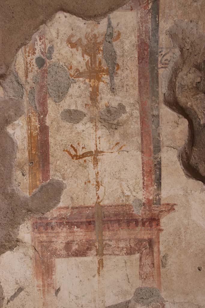 I.7.11 Pompeii. September 2021.
Detail of painted decoration at south end of east wall. Photo courtesy of Klaus Heese.