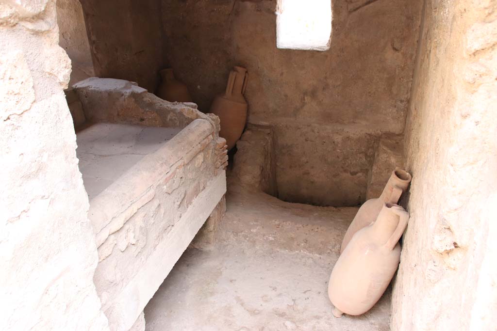 I.7.12 Pompeii. September 2021.
Looking south through doorway into kitchen and latrine. Photo courtesy of Klaus Heese.