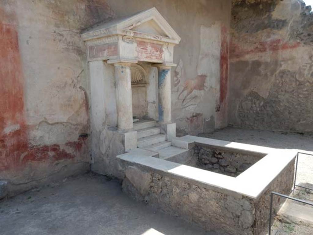 I.7.12 Pompeii. May 2017. Nymphaeum and water tank on south side of garden. Photo courtesy of Buzz Ferebee.