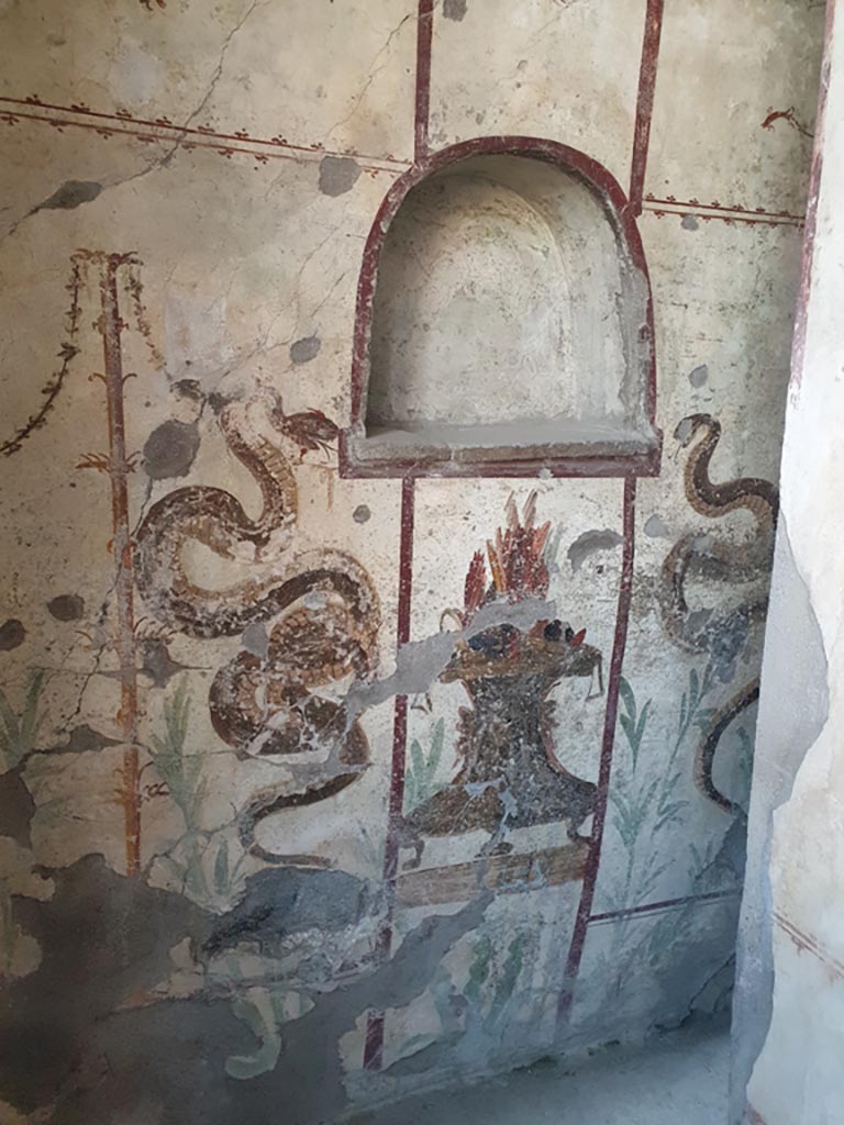 I.7.11 Pompeii. August 2023. Lararium against west wall. Photo courtesy of Maribel Velasco.