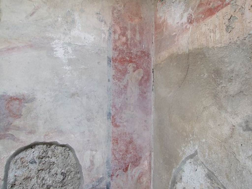 I.7.12 Pompeii. December 2006. South-west corner of garden, with wall painting on west side of nymphaeum. On the west end of the south wall, was a figure of a statue of a naked armed warrior.