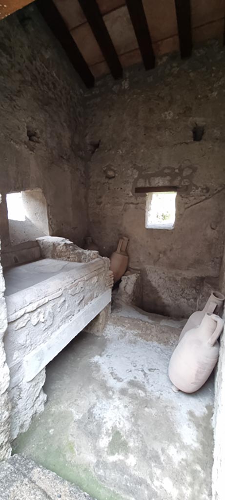 I.7.12 Pompeii. December 2023.
Looking south through doorway into kitchen and latrine.
Photo courtesy of Miriam Colomer.