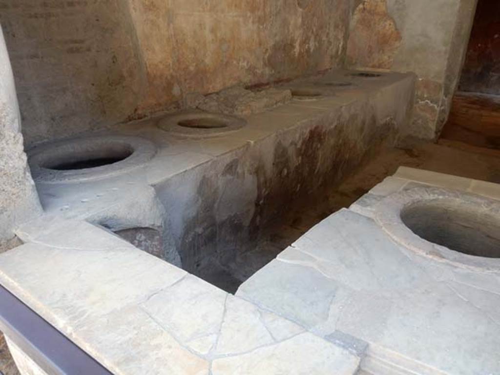 I.8.8 Pompeii. May 2015. East wall and three-sided counter.
Photo courtesy of Buzz Ferebee.