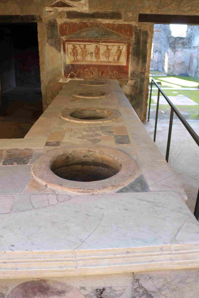 I.8.8 Pompeii. December 2018. Looking south along western side of bar-counter. Photo courtesy of Aude Durand.