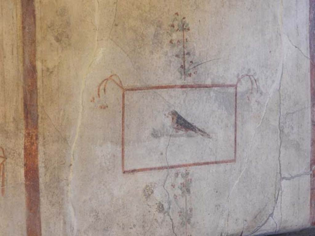 I.8.9 Pompeii. May 2015. Room 4, north wall detail of a painted panel of a bird.
Photo courtesy of Buzz Ferebee.