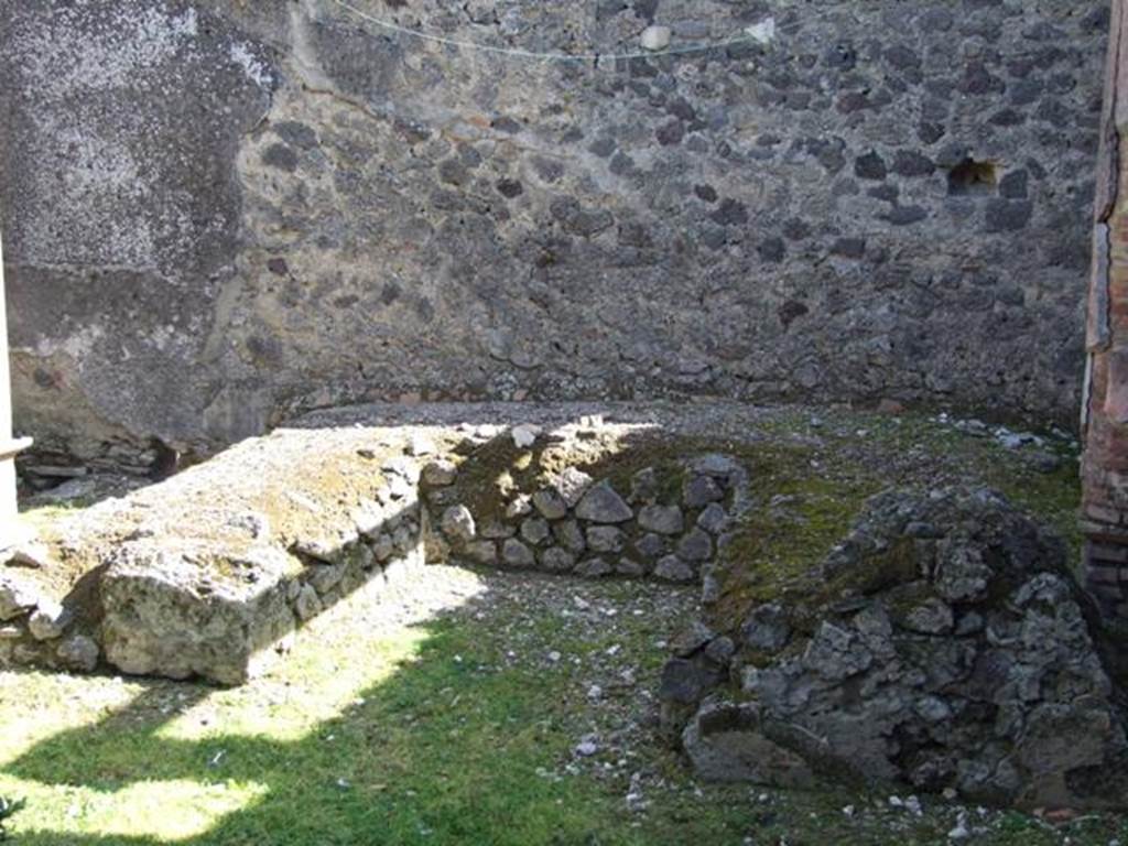 I.8.9 Pompeii. March 2009. Room 9 and Garden area. Triclinium against east wall.