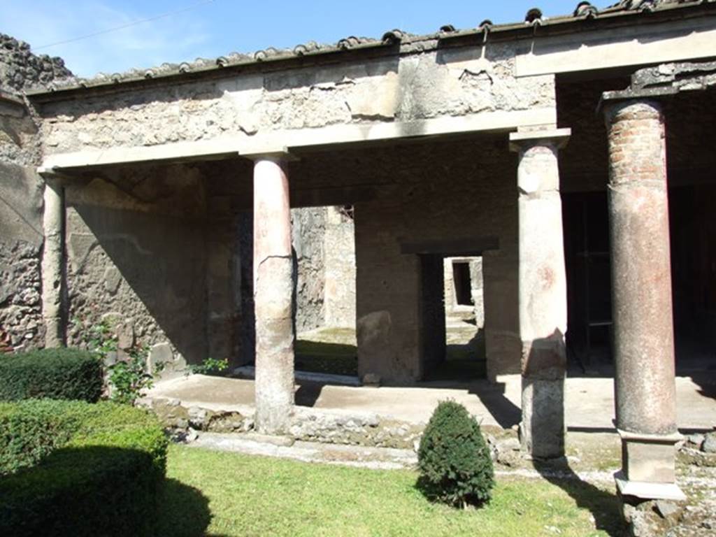 I.8.9 Pompeii. March 2009. Room 9 and Garden area. Looking north to portico.