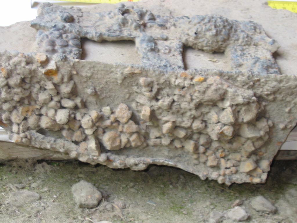 I.8.15-16, Pompeii. May 2003. Detail of iron grating removed from window. Photo courtesy of Nicolas Monteix.
