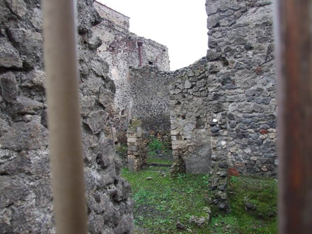 I.8.16 Pompeii. December 2007. Looking east from entrance towards rear rooms, with a niche in the north wall. December 2007.