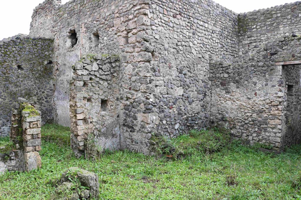I.8.16 Pompeii. December 2018.
Looking south-east across room/garden towards doorway to kitchen area, on left, and to a triclinium, on right.
The doorway, on the right, would have led into one of the rear rooms of I.8.15.
This doorway may have led into a triclinium for the clients. Photo courtesy of Aude Durand.