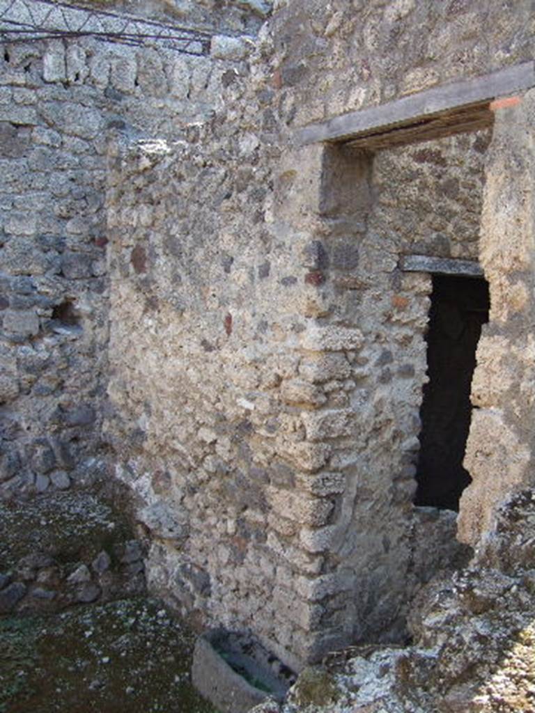 I.8.16 Pompeii. September 2005. Doorway in south wall, leading to one of the rear rooms at I.8.15.