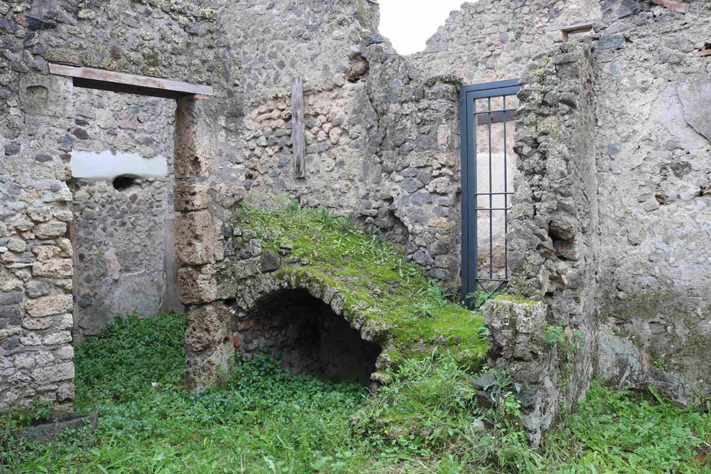 I.8.16 Pompeii. December 2018. Looking south-west across room/garden towards doorway to rear room of I.8.15, on left.
On the right is the entrance doorway on Vicolo dell’Efebo, which gave access to the stairs to the upper floor.
Photo courtesy of Aude Durand.