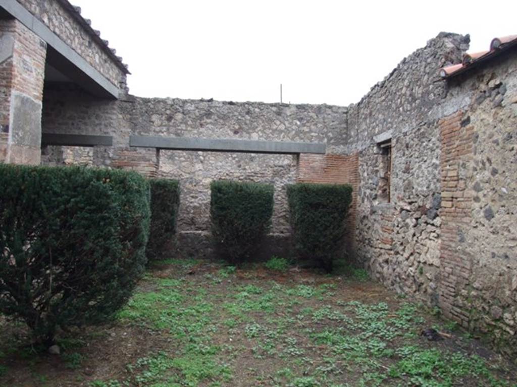 I.8.17 Pompeii. December 2007. Looking north across garden 17 with the window to room 23 on right.
