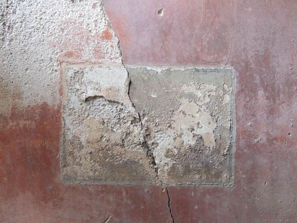 I.9.1 Pompeii. March 2009. Room 11, west wall south of door in the red middle area of the wall, remains of wall painting showing three masks.