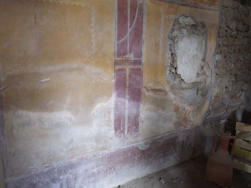 I.9.3 Pompeii. March 2009.
Room 10, north wall with site of painting of Successus, and hole made by ancient searchers, now filled in on the right.