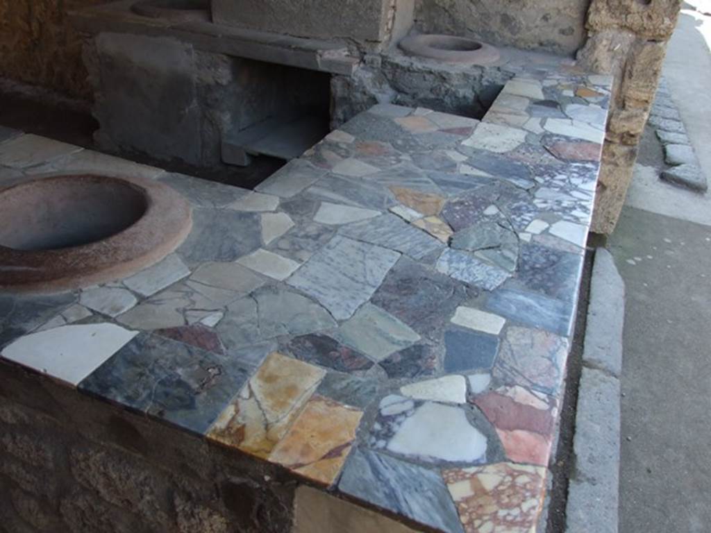 I.9.4 Pompeii. March 2009. Top of marble counter.