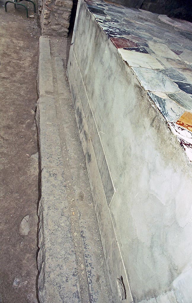 I.9.4 Pompeii. October 2001.
Looking east along front of counter and entrance sill. Photo courtesy of Peter Woods.