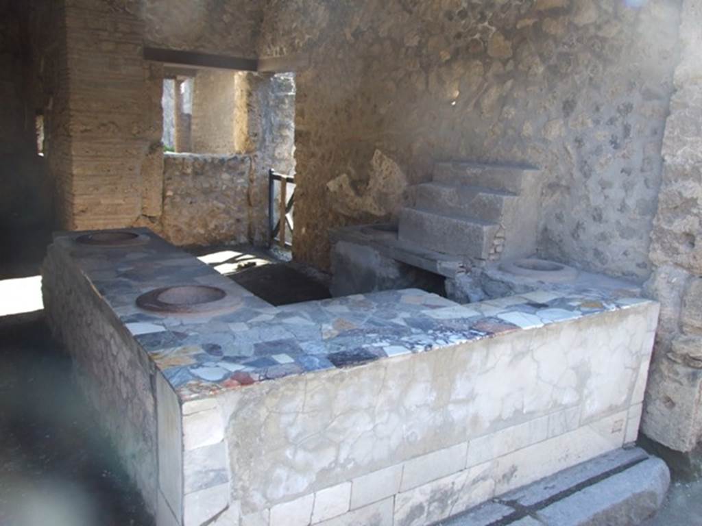 I.9.4 Pompeii. March 2009. West wall and counter.