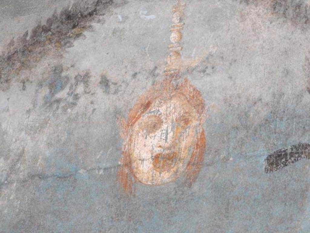 I.9.5 Pompeii, May 2018. Room 5, painted mask from centre of upper east wall. Photo courtesy of Buzz Ferebee.