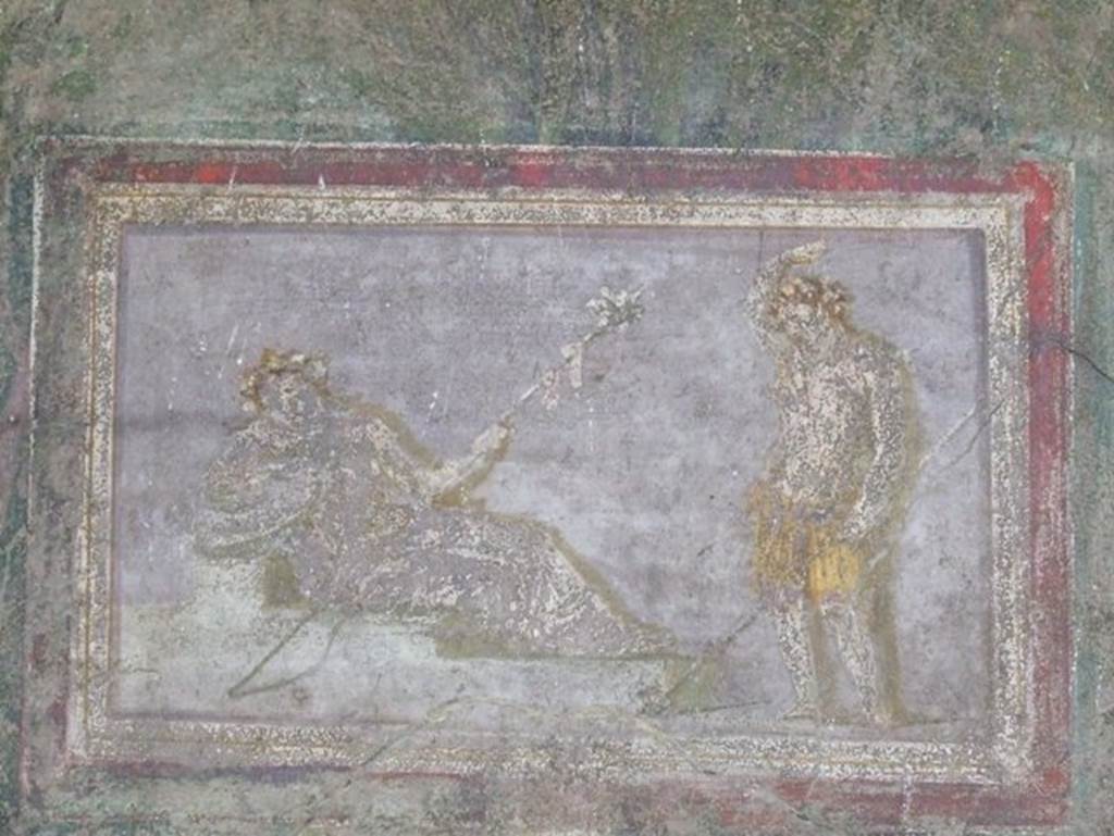I.9.5 Pompeii. March 2009. Room 5, cubiculum. East wall. Painting of Dionysus and maenad, or Ariadne.
See Bragantini, de Vos, Badoni, 1981. Pitture e Pavimenti di Pompei, Parte 1. Rome: ICCD. (p.95).
Kuivalainen describes -
“A composition of two whitish figures on a light grey background. On the left, a female in yellowish robe reclines on a stepped platform, leaning on her right arm; in her left hand she holds a thyrsus; her head, adorned with a wreath of ivy, is depicted frontally. On the right stands a youth wearing only a yellow loincloth; he raises his right hand on top of his head, while the left hand holds a thyrsus with a ribbon, and possibly a pine cone at the bottom. The two thyrsi are depicted in parallel lines.”
Kuivalainen comments –
“It is not unusual for the standing young Bacchus to raise his right arm above his head, as in several other paintings. The reclining fully robed figure is most likely Ariadne.”
See Kuivalainen, I., 2021. The Portrayal of Pompeian Bacchus. Commentationes Humanarum Litterarum 140. Helsinki: Finnish Society of Sciences and Letters, (p.144-5, E5).