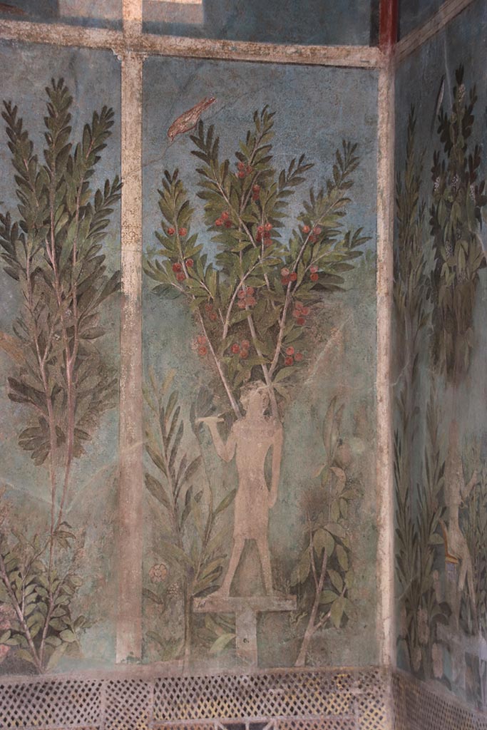 I.9.5 Pompeii. October 2024.
Room 5, detail of painting of Egyptian pharaonic statue and cherry tree from south end of east wall of cubiculum.
Photo courtesy of Klaus Heese.