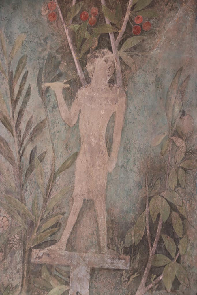 I.9.5 Pompeii. October 2022.
Room 5, detail of painting of Egyptian pharaonic statue and cherry tree from south end of east wall of cubiculum.
Photo courtesy of Klaus Heese.