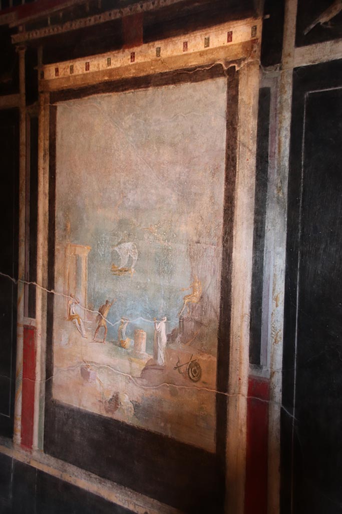 I.9.5 Pompeii. October 2024.
Room 10, central painting of Daedalus and Icarus, from east wall. Photo courtesy of Klaus Heese.