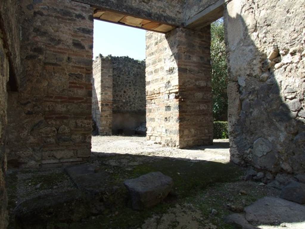 I.9.5 Pompeii. March 2009. Room 15. Kitchen. Looking north west towards doorways to Triclinium and Peristyle.
