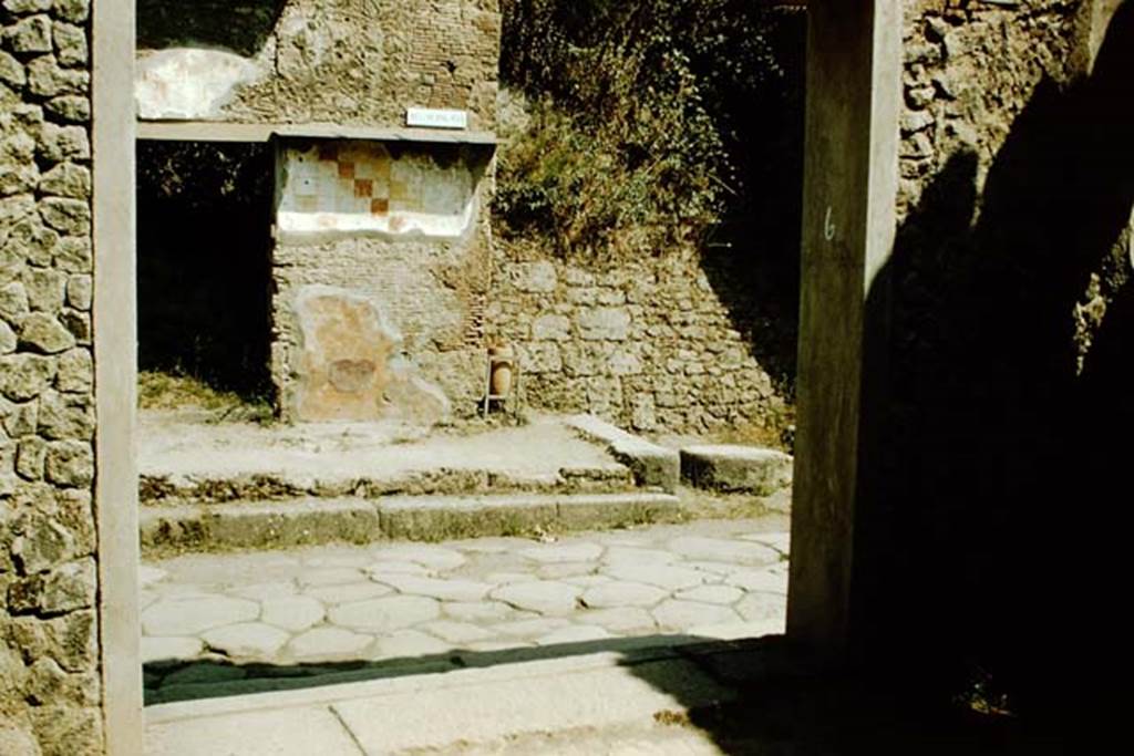 I.9.6 Pompeii. 1957. Looking north through entrance doorway, across Via dell’Abbondanza towards the doorway of IX.13.6. Photo by Stanley A. Jashemski.
Source: The Wilhelmina and Stanley A. Jashemski archive in the University of Maryland Library, Special Collections (See collection page) and made available under the Creative Commons Attribution-Non Commercial License v.4. See Licence and use details.
J57f0220
