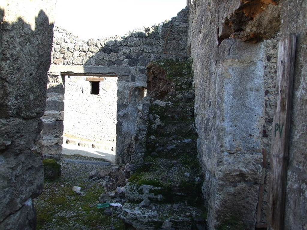 I.9.9 Pompeii. December 2006. Looking east in entrance fauces, to stairs to upper floor and entrance.
