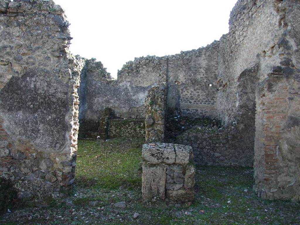 I.9.10 Pompeii. December 2006. South wall of atrium with doorways to three rooms. On the left, the kitchen, in the middle at the rear a storeroom, and doorway on the right to a small room, possibly another storeroom.