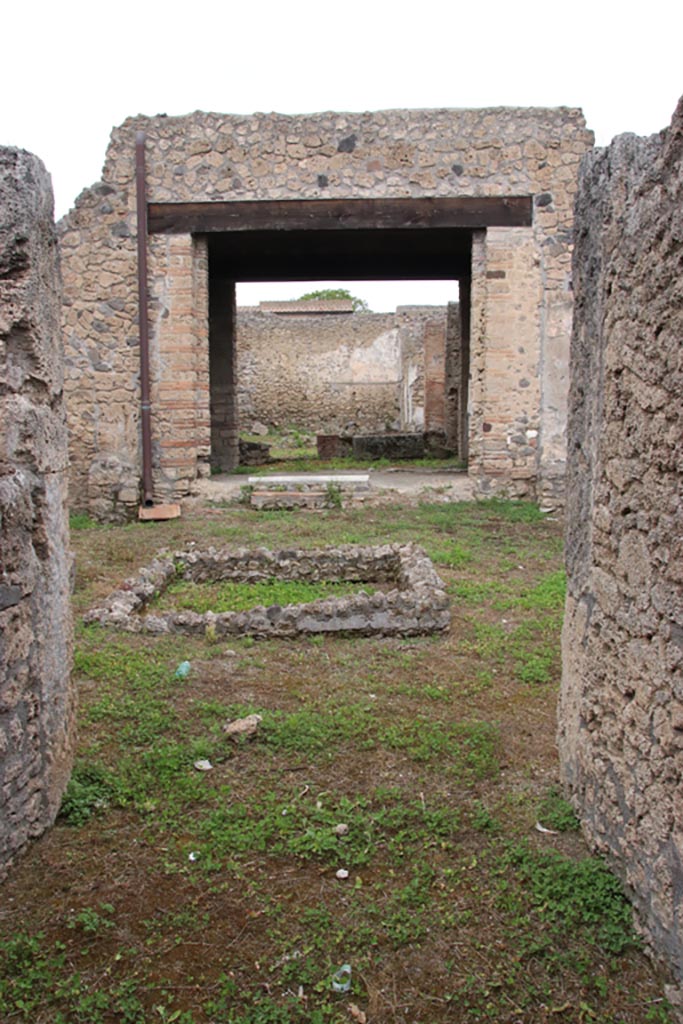 I.9.12 Pompeii. May 2024.
Looking north across atrium towards tablinum, from entrance corridor/fauces. Photo courtesy of Klaus Heese.