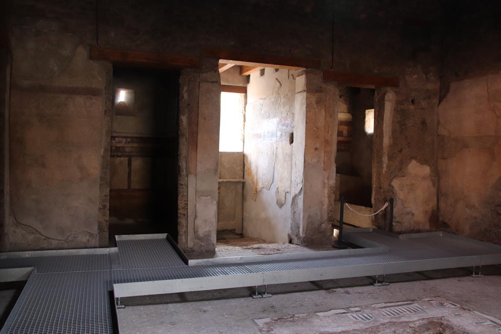 I.9.14 Pompeii. October 2022.
Room 8, looking south in atrium towards doorway to room 13, on left, entrance corridor, in centre, and room 14, on right. Photo courtesy of Klaus Heese.