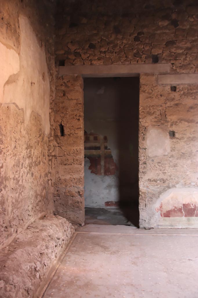 I.9.14 Pompeii. October 2022.
Doorway to room 9, in north-west corner of atrium. Photo courtesy of Klaus Heese.