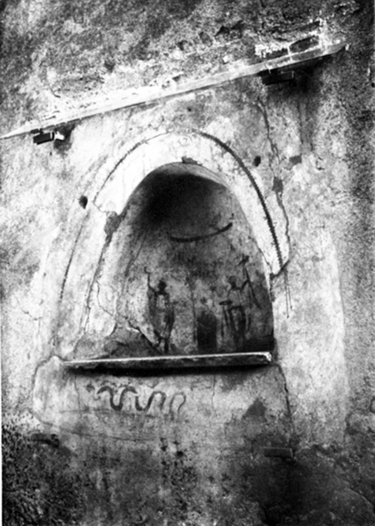 I.10.3 Pompeii. 1937. Niche on east wall of fauces.
The red inscription “Felix aeris IV as, Florus X.” can be seen below the garland in the niche.
Comparing our photos and the original in NdS, and the angle of the graffiti recorded by Varone, show that Boyce’s photo in plate 14,2 is reversed.
His description saying the snake is “advancing r.” must therefore be taken to mean “from the right”.
See Boyce G. K., 1937. Corpus of the Lararia of Pompeii. Rome: MAAR 14, p. 27 no. 42, pl. 14,2 (the photo here has been reversed and corrected).
See Varone, A. and Stefani, G., 2009. Titulorum Pictorum Pompeianorum, Rome: L’Erma di Bretschneider, p. 120.