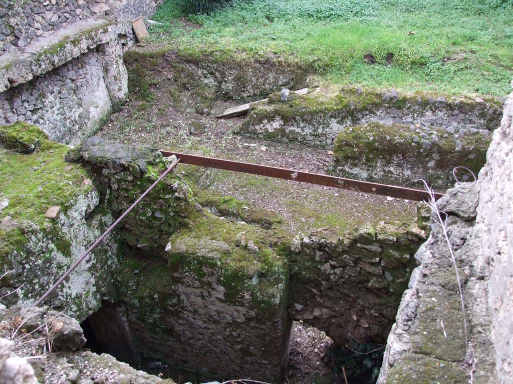 I.10.4 Pompeii. December 2006. Looking west from room 47 to rooms below.