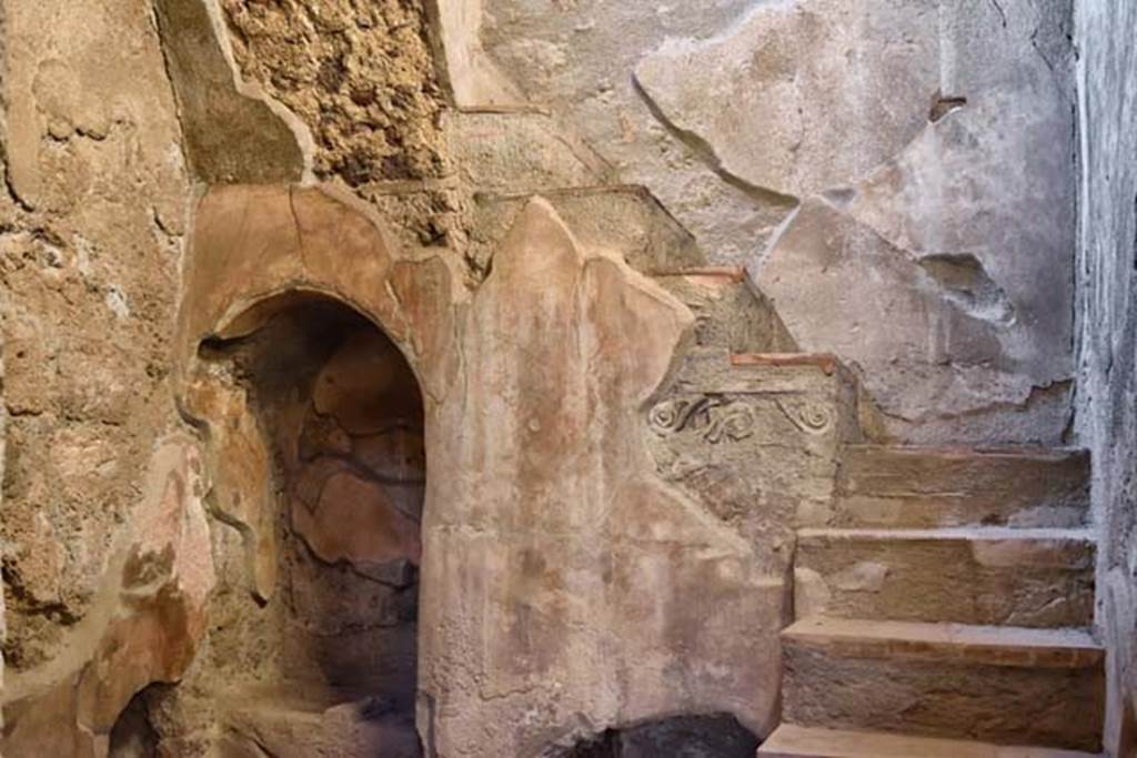 I.10.4 Pompeii. April 2018. Looking towards the recess with small masonry altar with two cavities in the top, lower left. Photo courtesy of Ian Lycett-King. Use is subject to Creative Commons Attribution-NonCommercial License v.4 International.