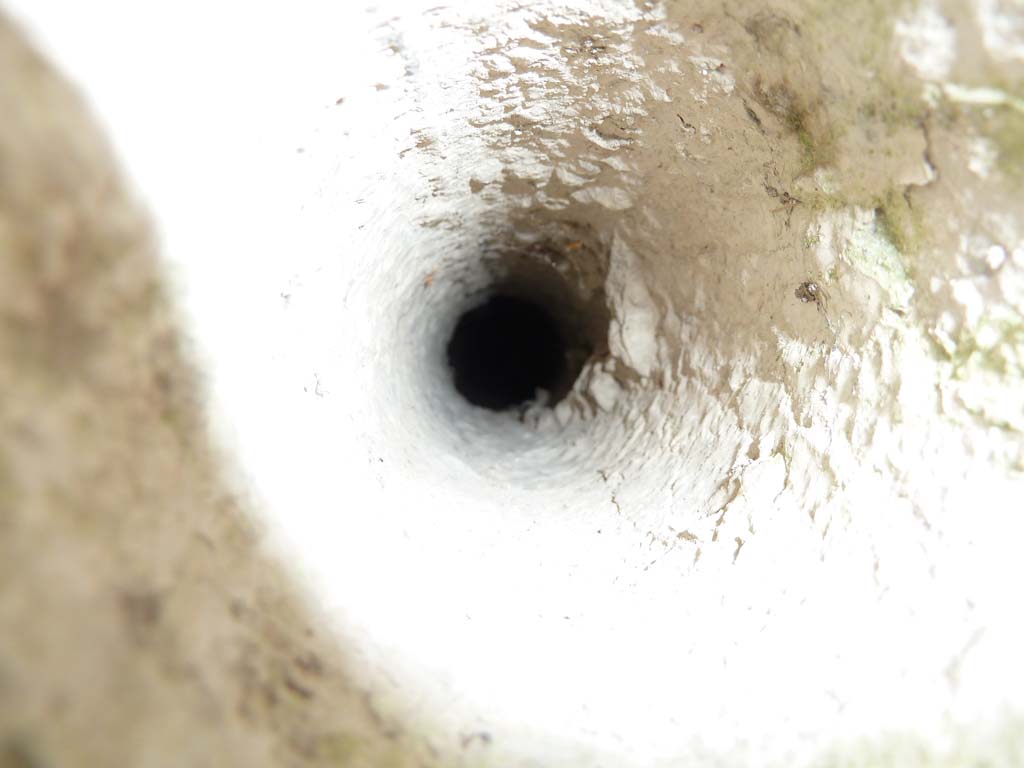 I.10.4 Pompeii. May 2010. Hole in west portico floor, ventilation for the Sarno canal.