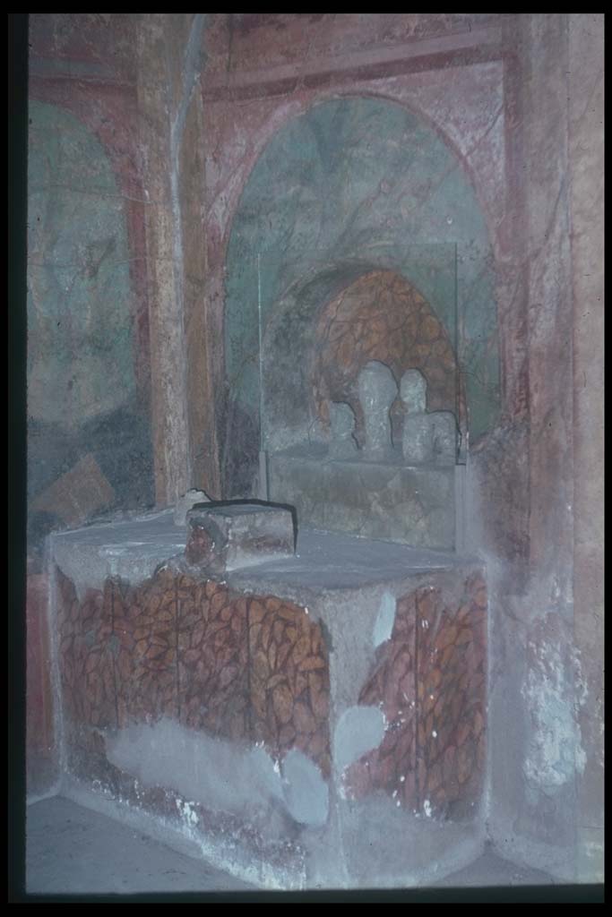 I.10.4 Pompeii. Alcove 25 in south-west corner of peristyle. 
Lararium or domestic shrine with built in altar and apsed niche.
Photographed 1970-79 by Günther Einhorn, picture courtesy of his son Ralf Einhorn.
